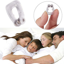 Silicone anti-snore nose clip with magnetic beads held between fingers, promoting peaceful sleep for heavy snorers.